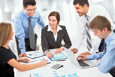 Edmonton CPA team discussing tax strategy with small business owner