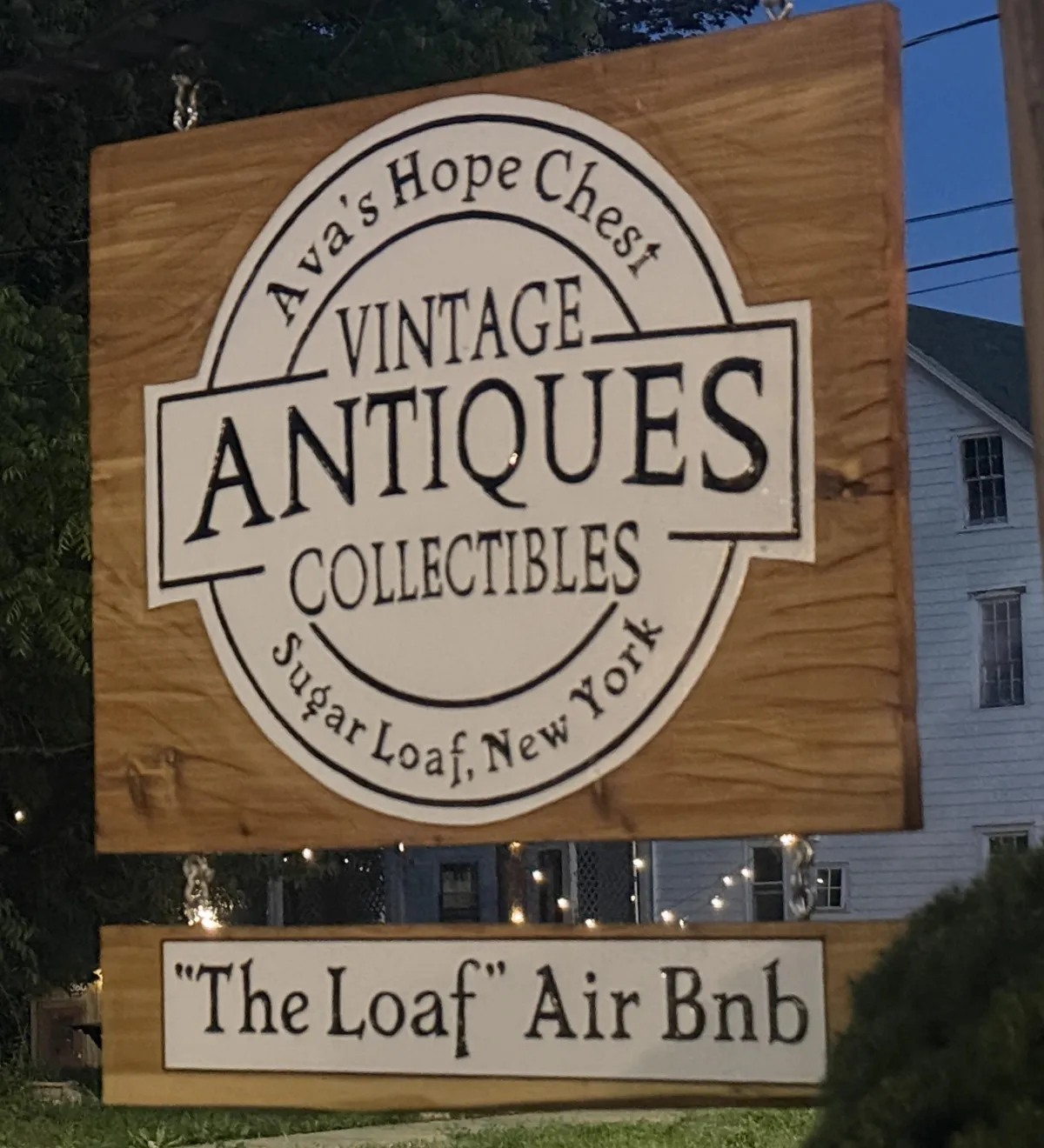 Hand-carved wooden storefront sign for Ava's Hope Chest in Sugarloaf, NY by Sundanced Wood