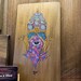 Rustic carved wood plaque finished in a natural wood stain