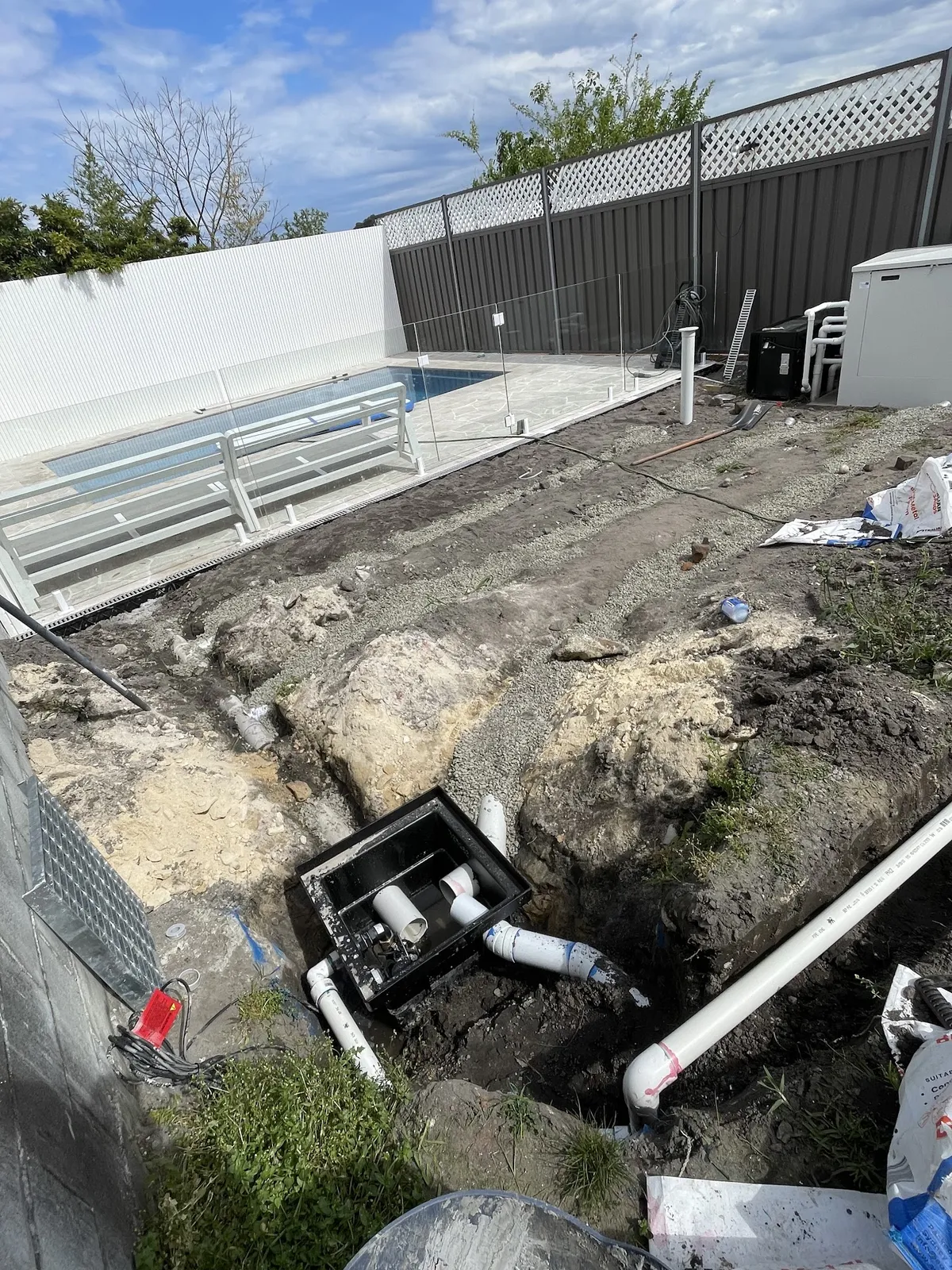 Stormwater pit and pipes in a backyard