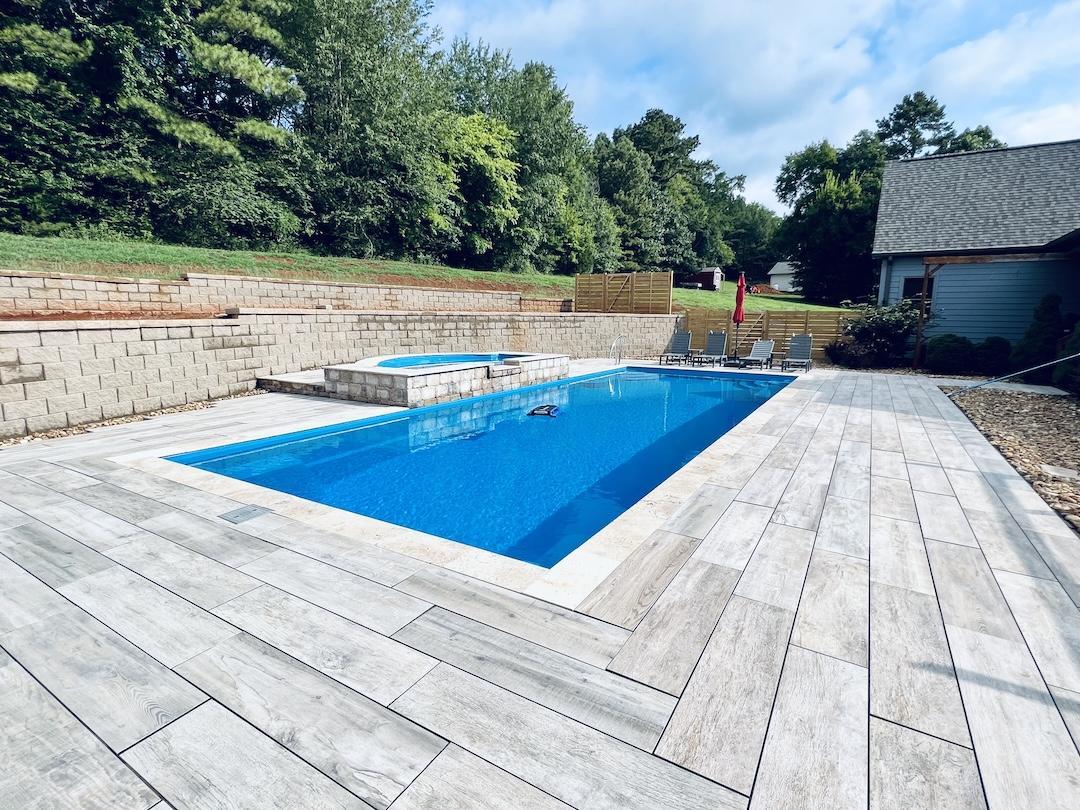 custom pool with hot tub feature