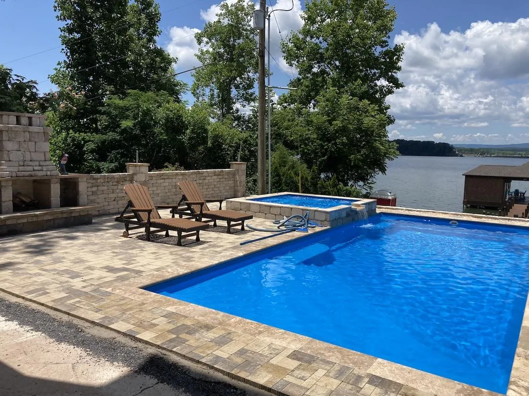 custom pool with hot tub feature