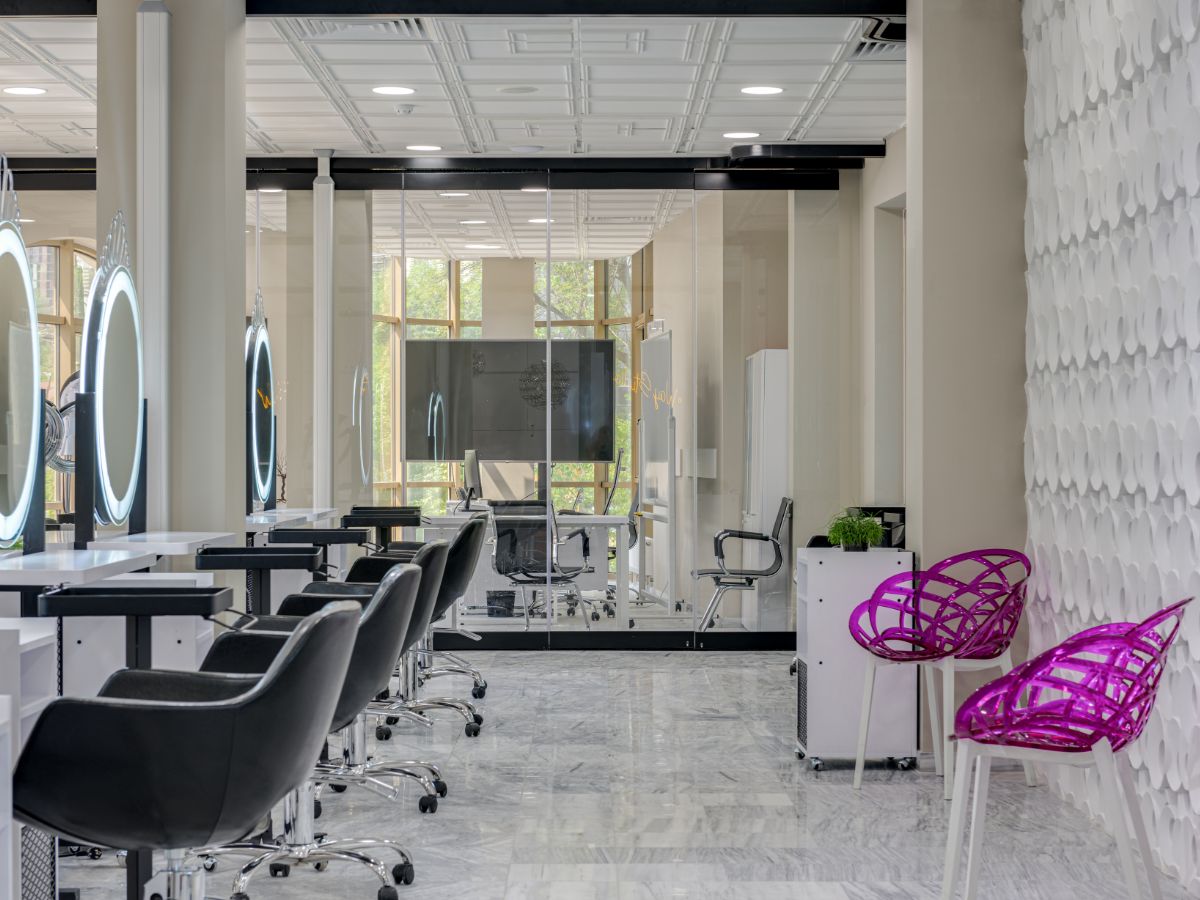 a living room filled with furniture and a chandelier