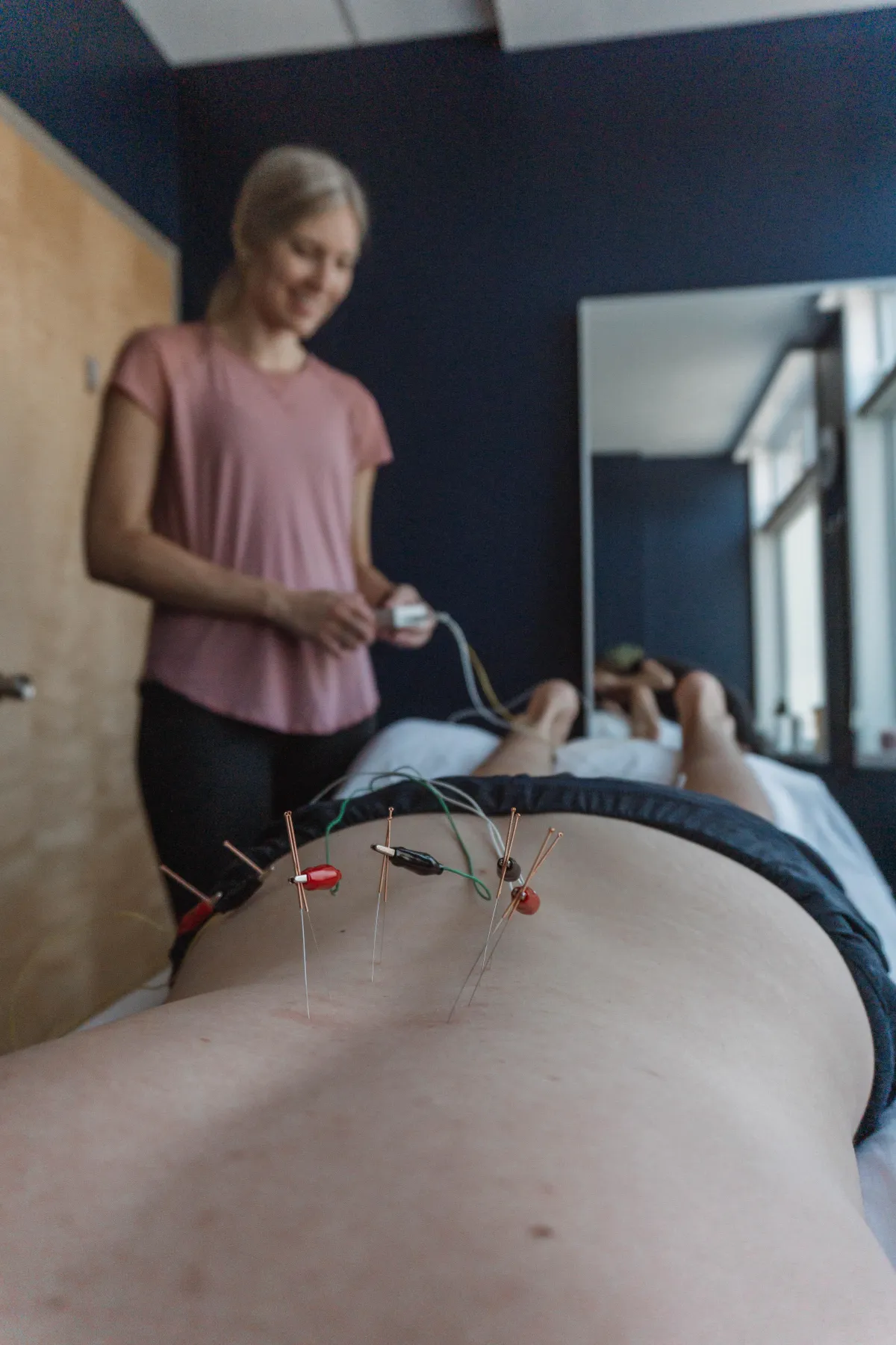 Kristin Bignell, Physiotherapist, working with a female athlete in the gym on a custom exercise program