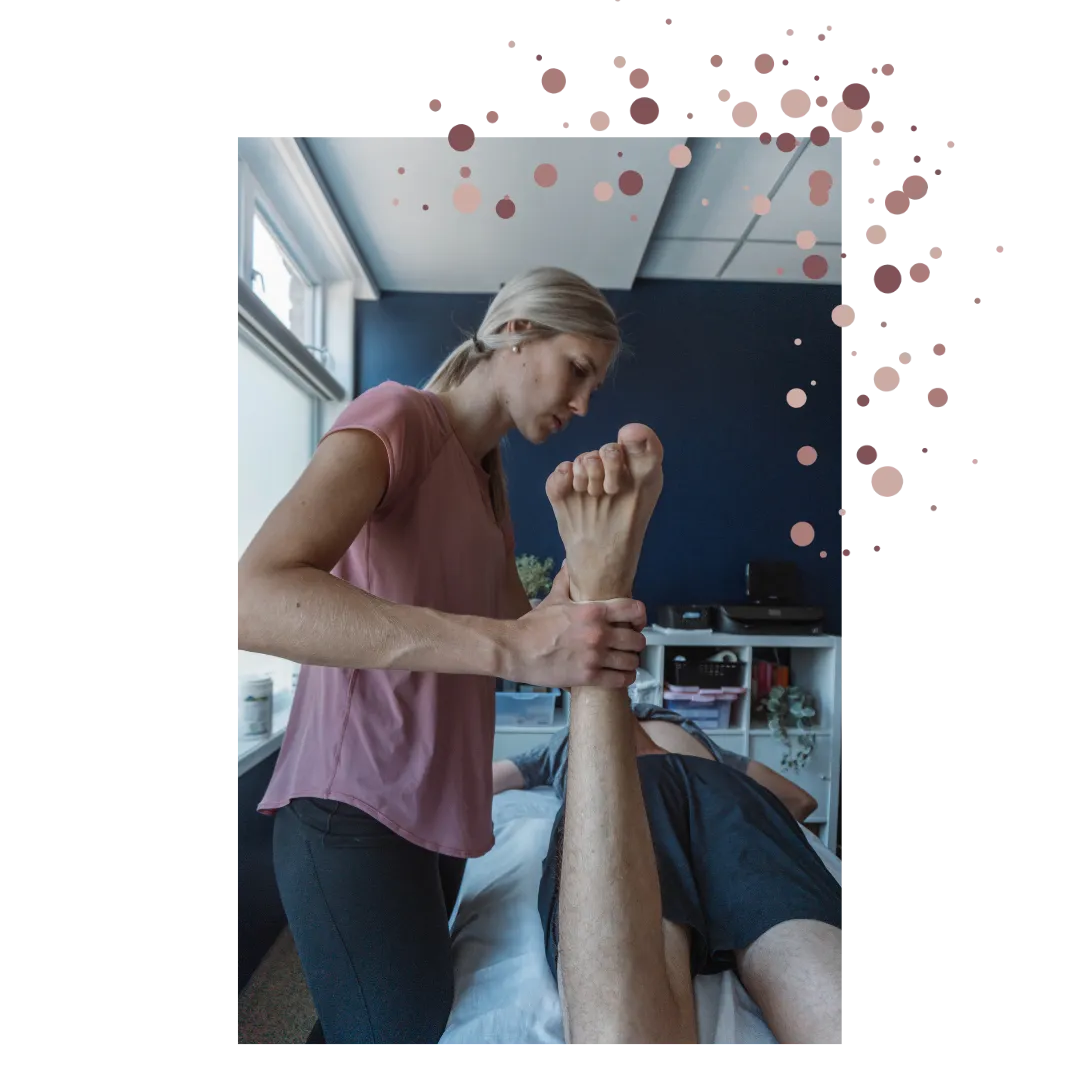 Kristin Bignell, physiotherapist, performing muscle testing on an athlete's ankle