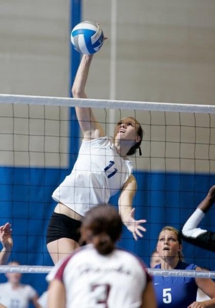 Kristin Bignell, Registered Physical Therapist blocking a volleyball