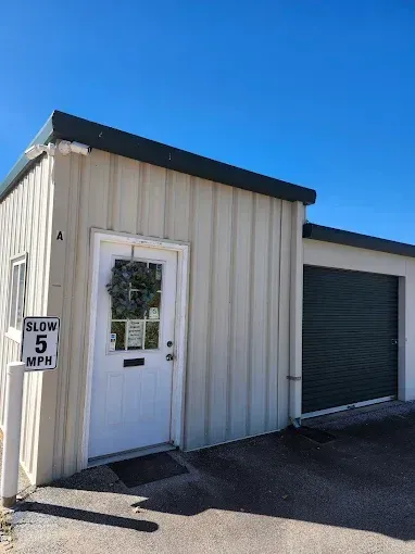 A futuristic security robot with flashing lights on display.
