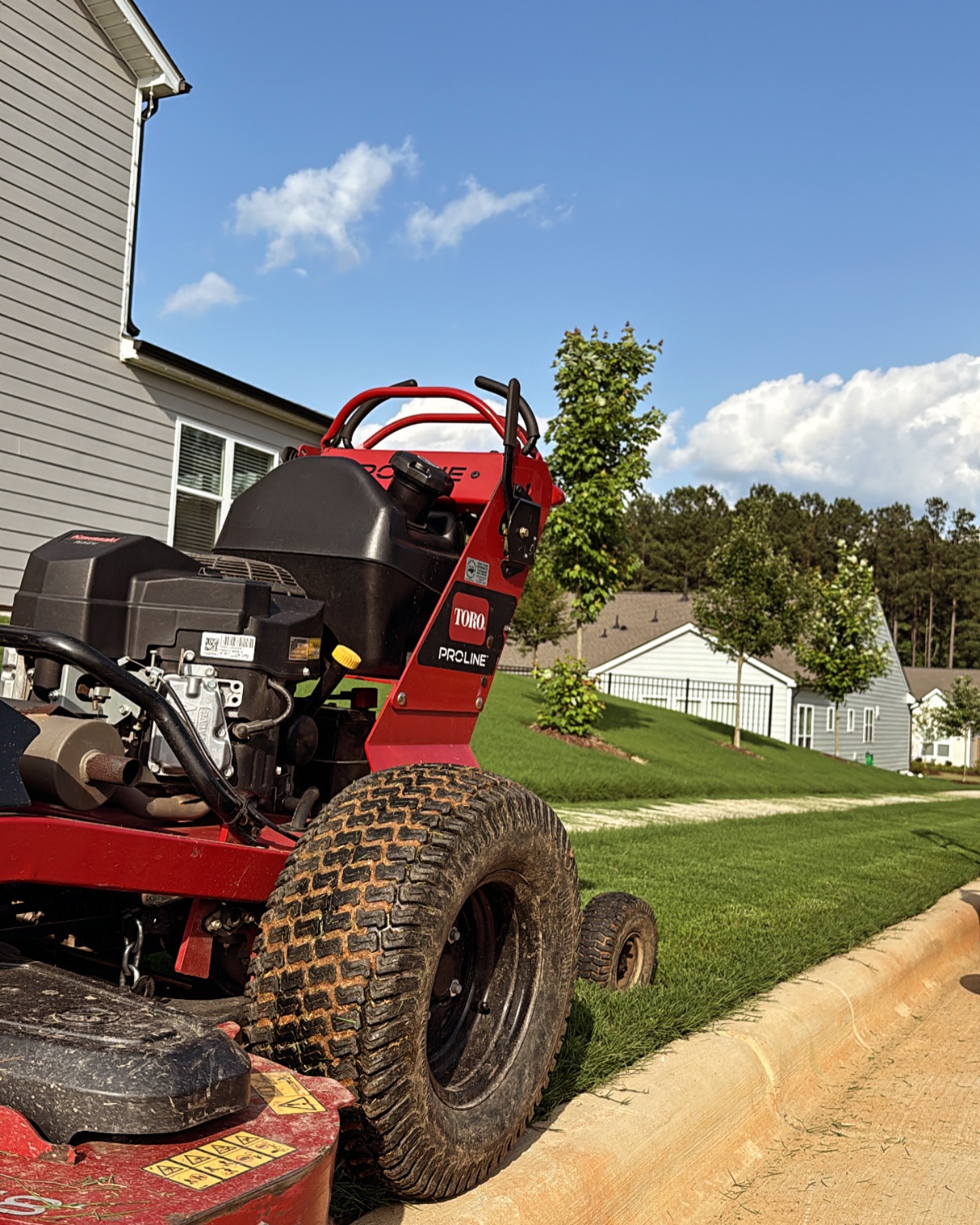 Toro commercial mower on a freshly cut lawn at a home in Fuquay-Varina, North Carolina.