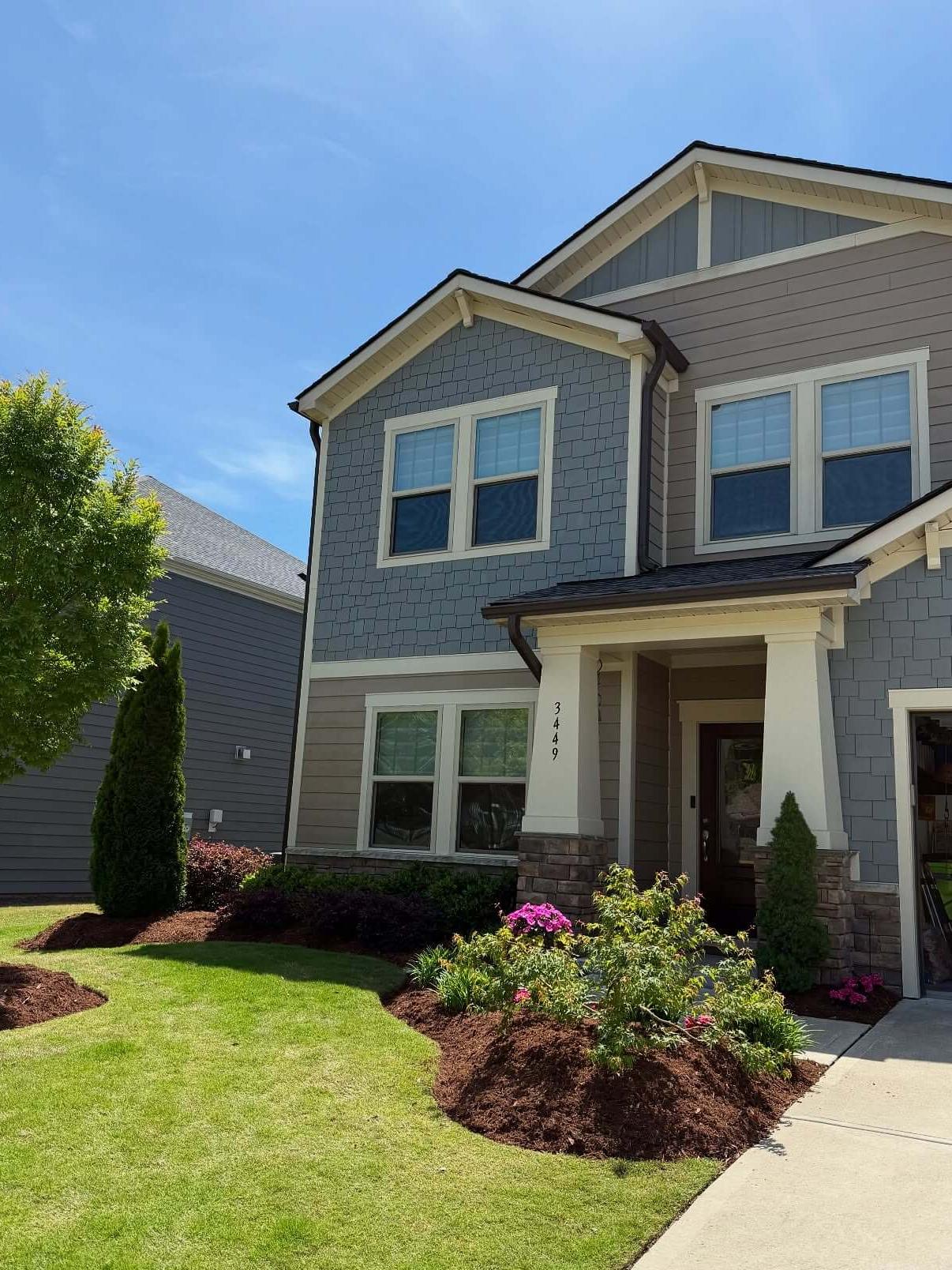 Landscape design Apex NC showing curved mulch beds, ornamental planting layout, and front yard curb appeal landscaping