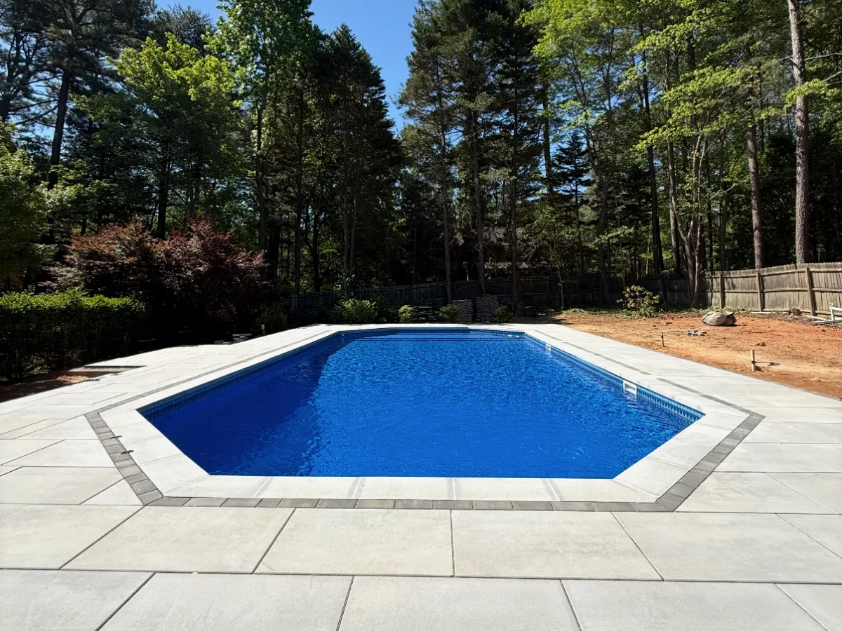 hardscape patio with pavers and stone features installed in Raleigh NC
