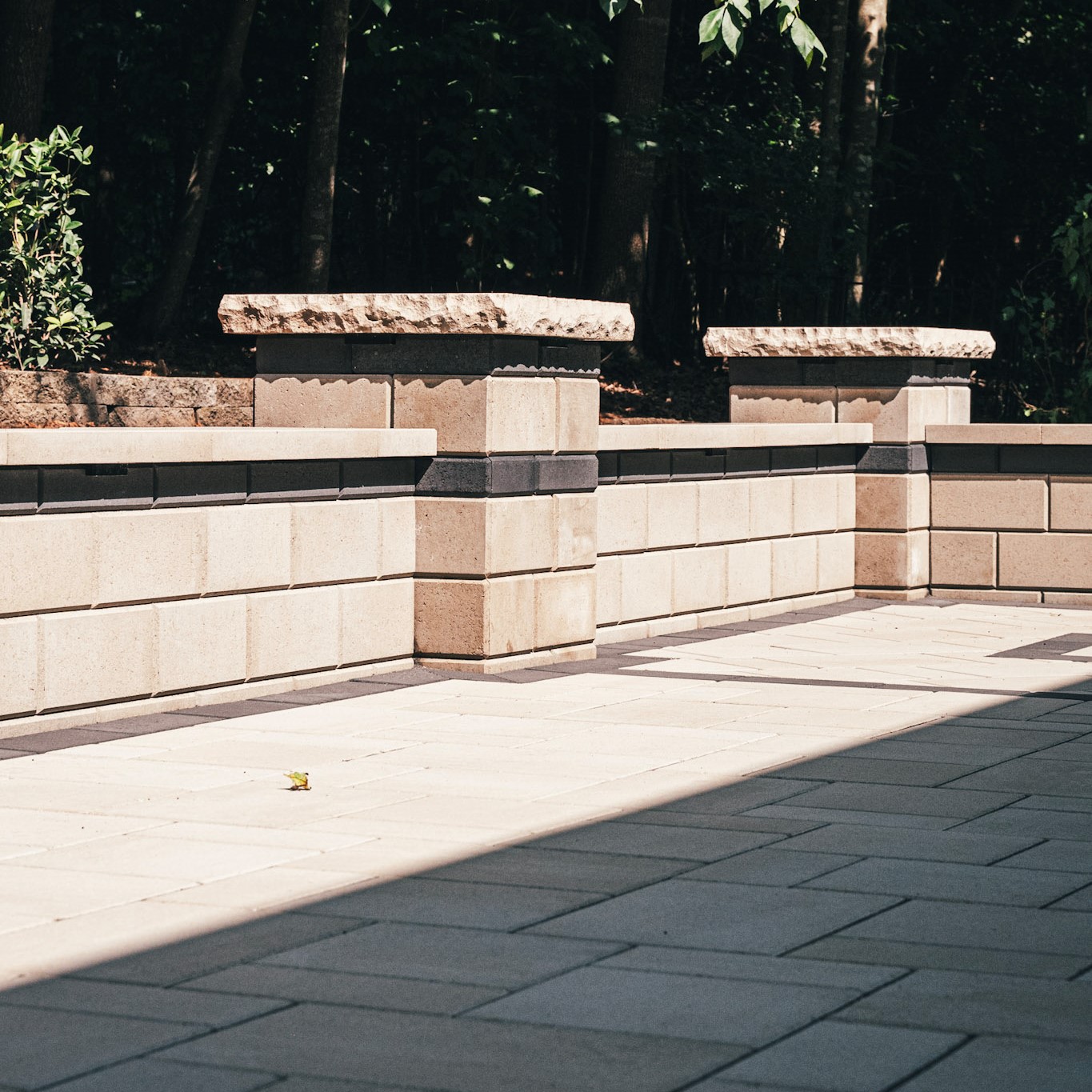 retaining wall installation with stone blocks in Raleigh Durham NC