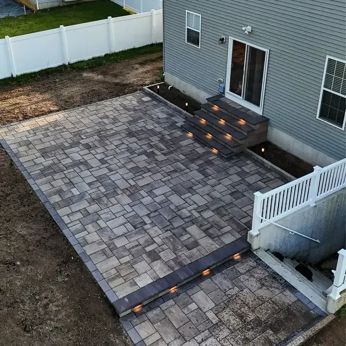 paver patio installation with step lighting in Raleigh Durham NC