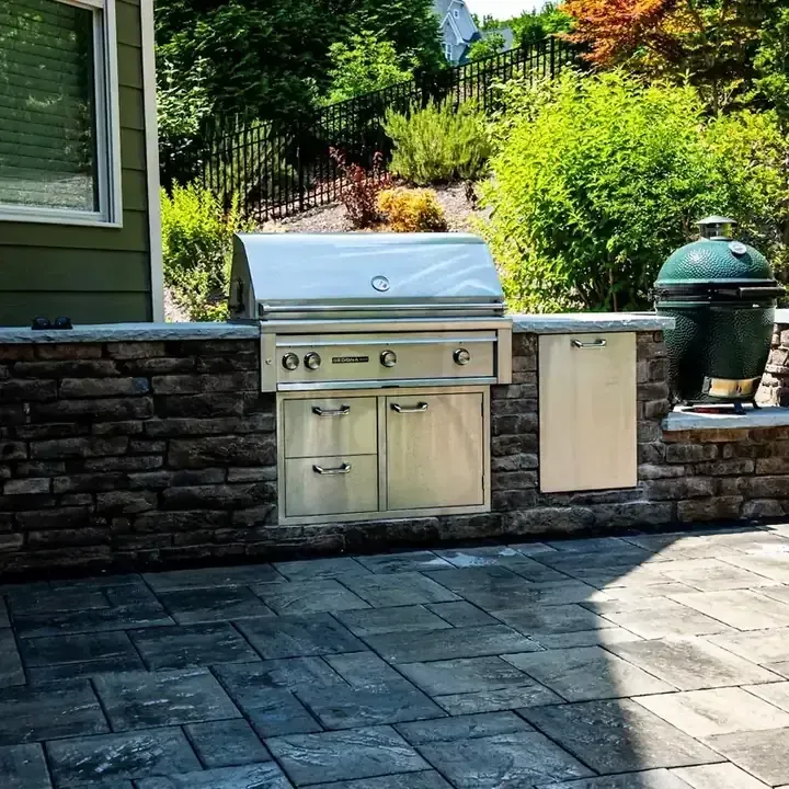custom fire pit and outdoor kitchen design in Raleigh Durham backyard
