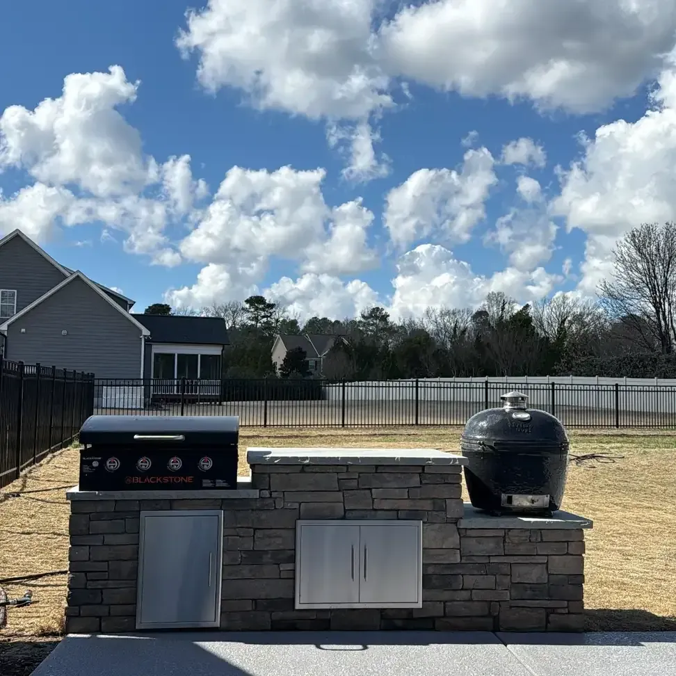 custom outdoor kitchen with built-in grill installed in Raleigh Durham area