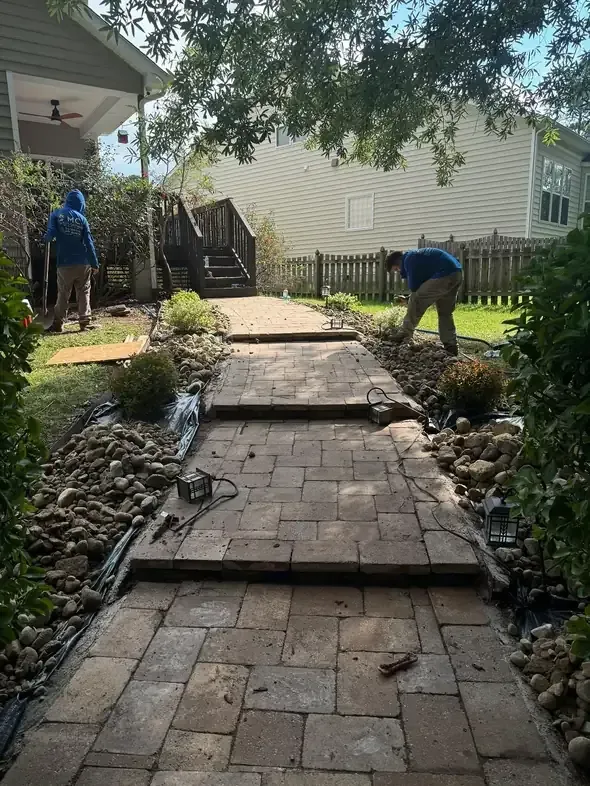 MC Landscaping crew installing paver walkway in Raleigh Durham area
