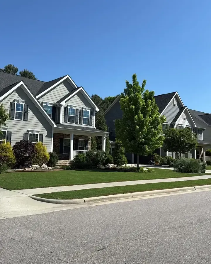 landscaping project with clean bed edging and green lawn in Raleigh Durham area