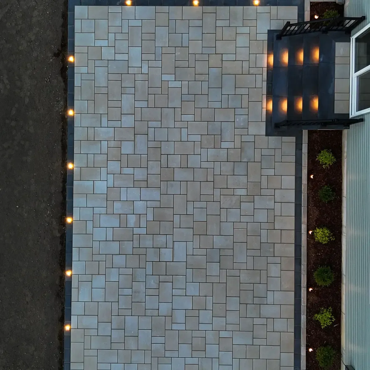 stone wall hardscape with outdoor lighting in Raleigh Durham area