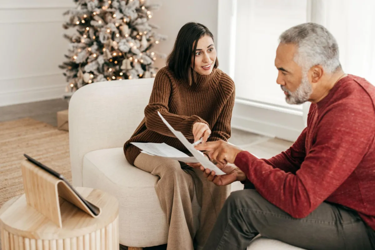 a man and a woman standing next to each other holding dumbs
