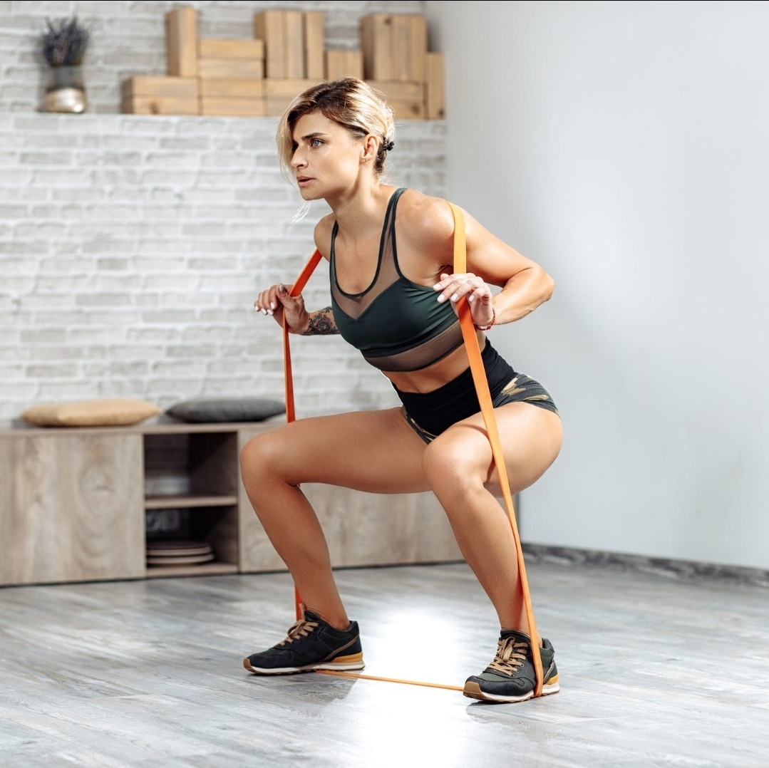 a woman squatting on the floor