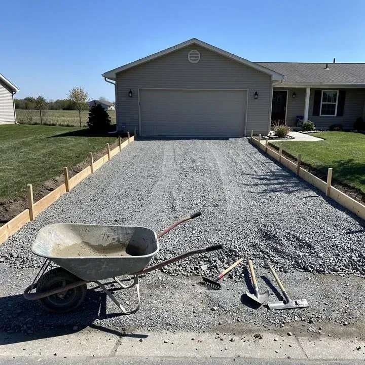 Wooden concrete forms set up and ready for a driveway pour at a job site in Pendleton, Indiana.