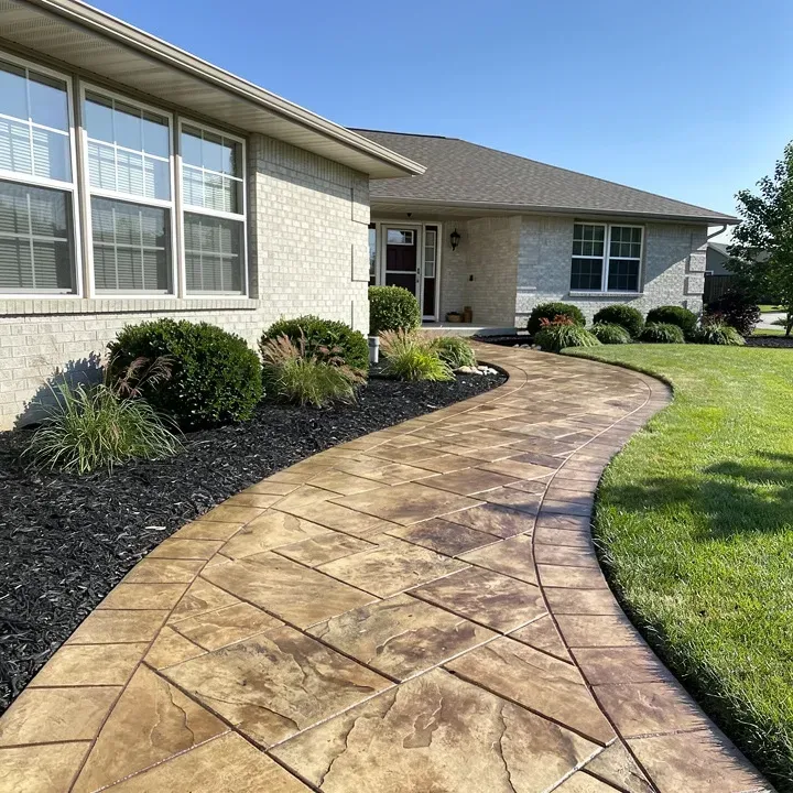 Finished stamped concrete walkway with stone pattern at an upscale home in Pendleton, Indiana.