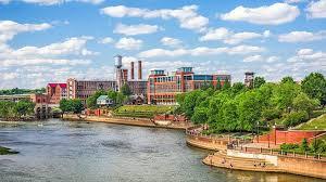 Chattahoochee River and downtown Columbus under a blue sky
