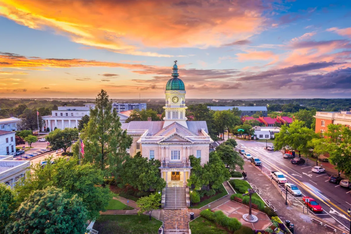 Downtown Athens skyline at sunset with historic buildings and lush trees