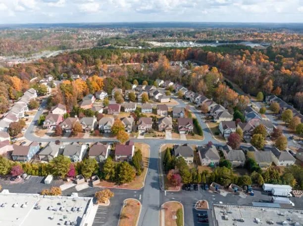 Suburban aerial view of Johns Creek homes and tree-lined streets
