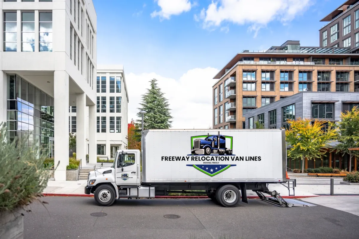 a man in a yellow hat holding a box