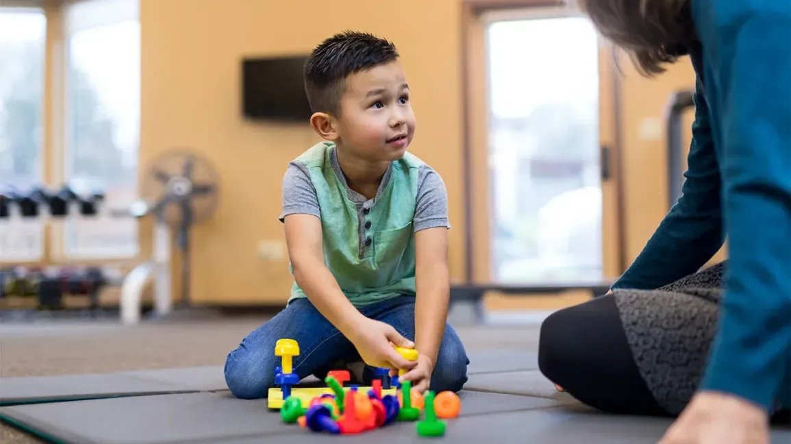 boy playing in child play therapy