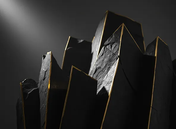 a rocky outcrop with golden edges in a spotlight