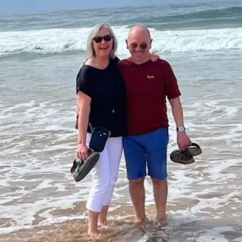 A photo of Lou and her husband Tony at he beach