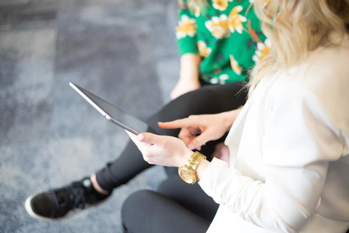 Consultant touching tablet 