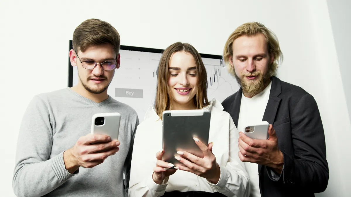 Staff checking devices seeing new clients and leads