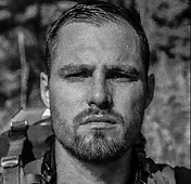 Portrait of Dr. Maya Reyes, physiotherapist, smiling in a clinic environment