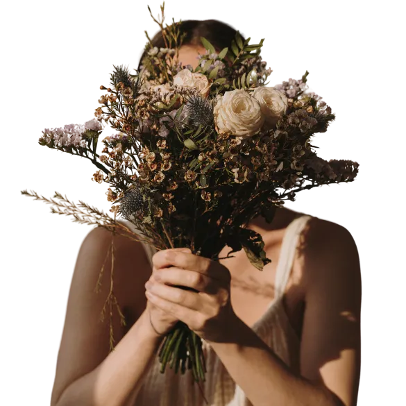 Sensitive woman with flowers loving herself.