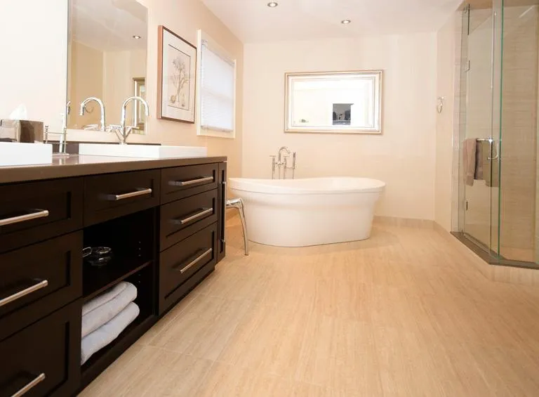 Modern bathroom featuring heated porcelain tile flooring in Durham Region home