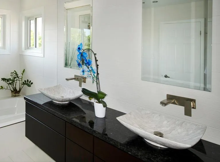 Luxury master bathroom featuring custom double vanity with quartz countertop in Durham Region home