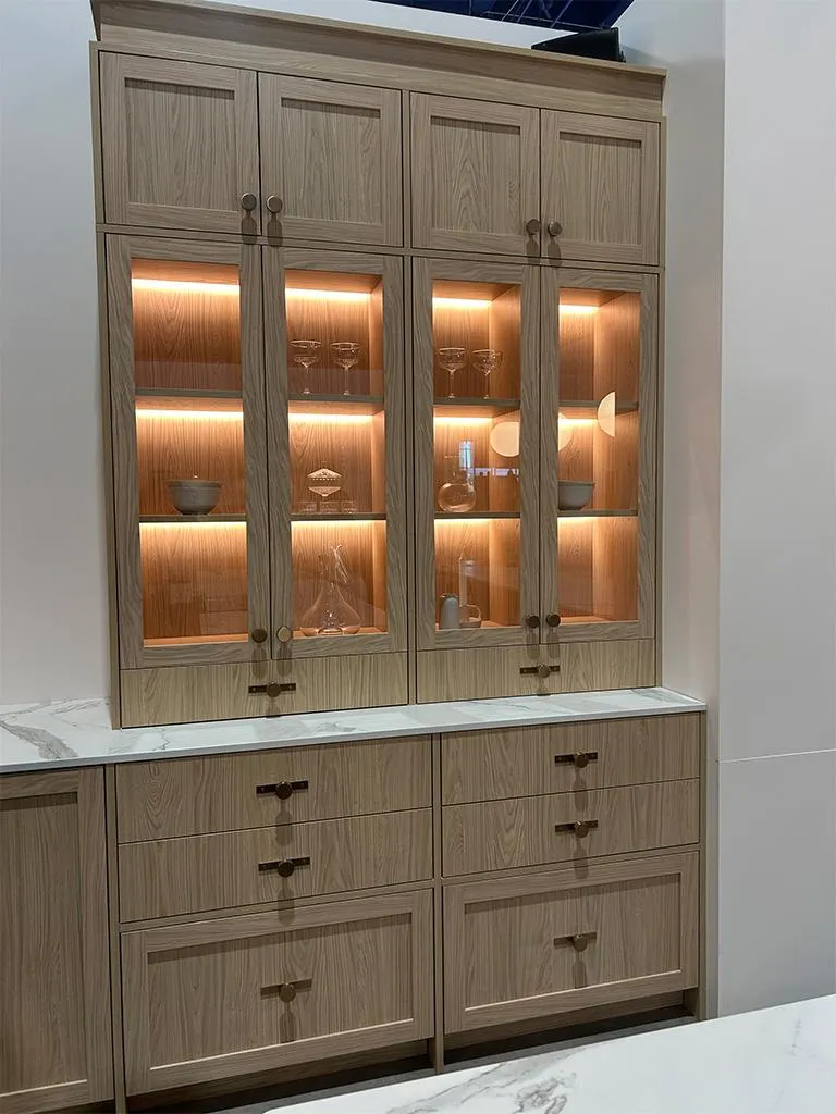 Modern kitchen featuring stylish pendant lights over island and LED under-cabinet lighting in Durham Region home