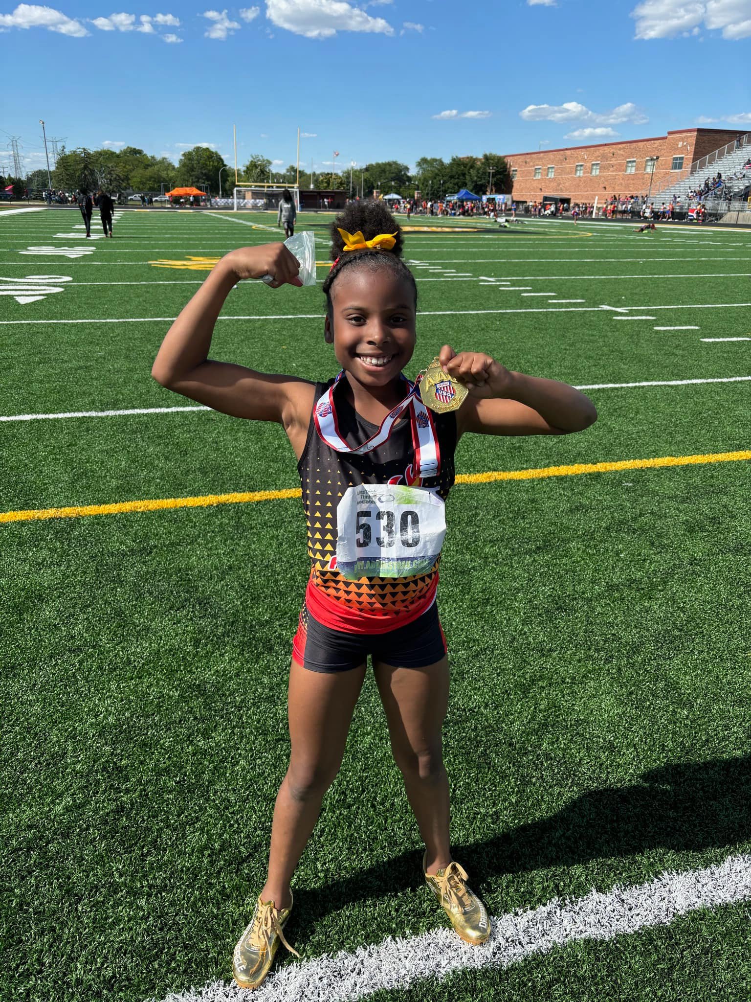 Coach mentoring youth athlete on the track