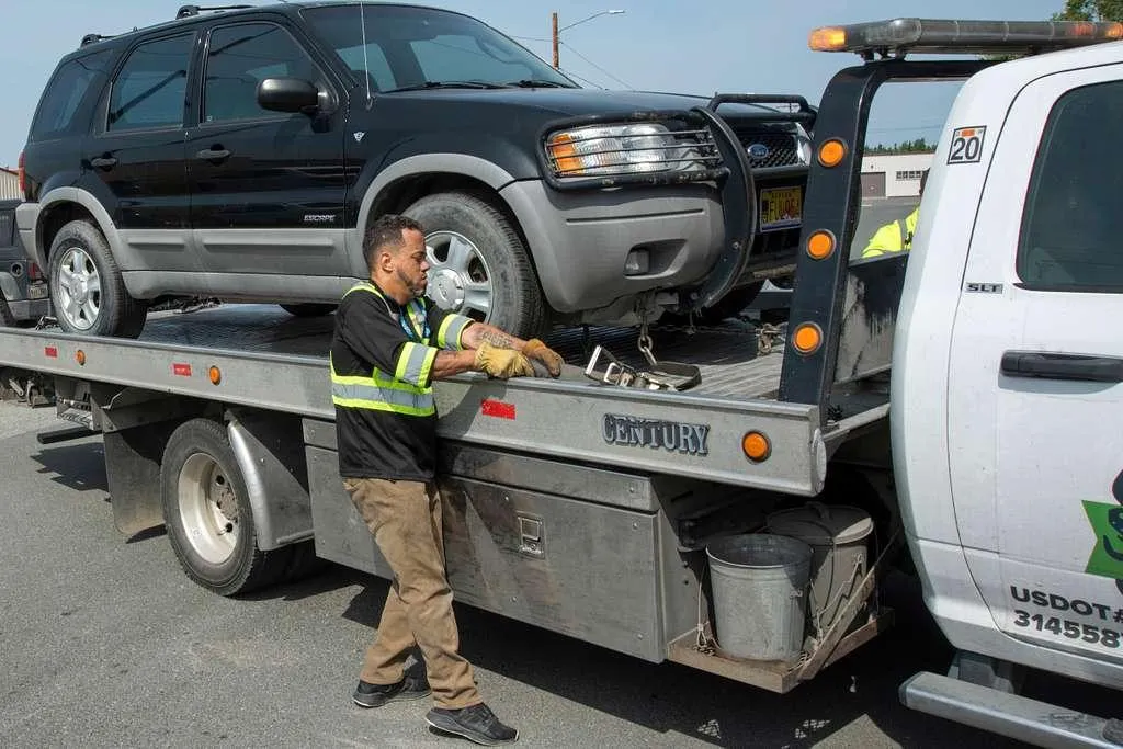 trailer truck passing on road near rail guard