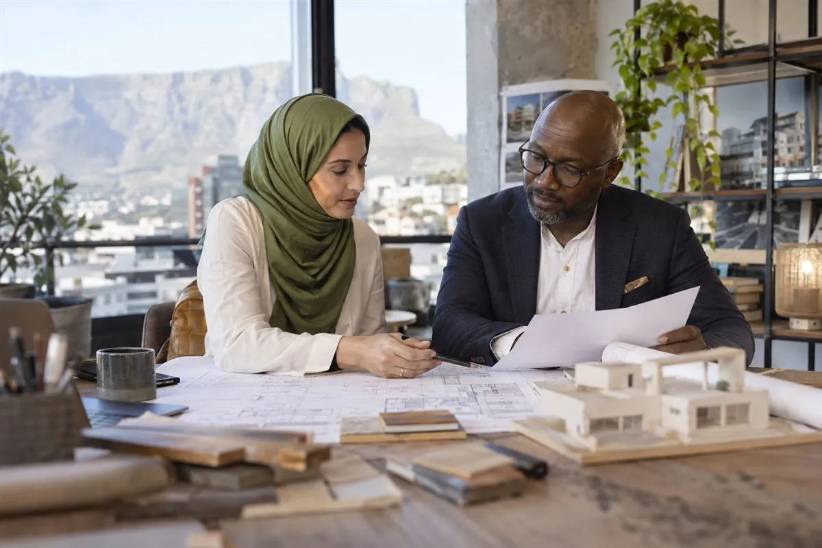 Illustrative business partners reviewing a financing agreement
