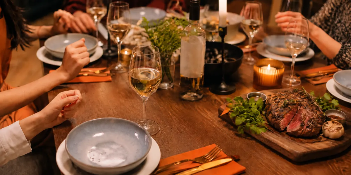 a long table with a bunch of glasses on it