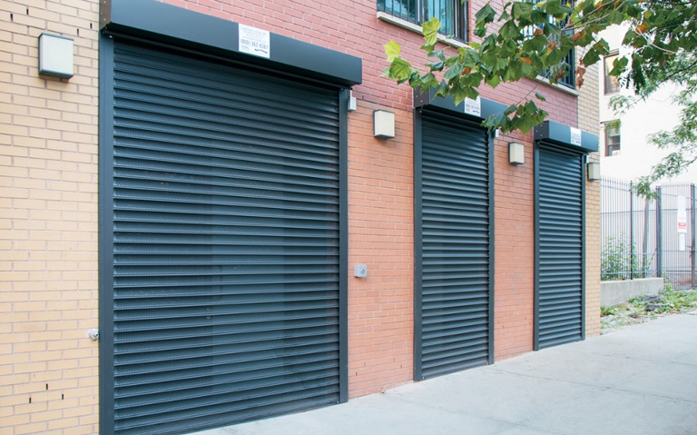 commercial steel overhead doors on brick building from Overhead Door Company of Flathead Valley™