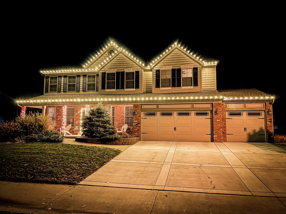 Loveland home with professionally installed LED roofline Christmas lights warm white
