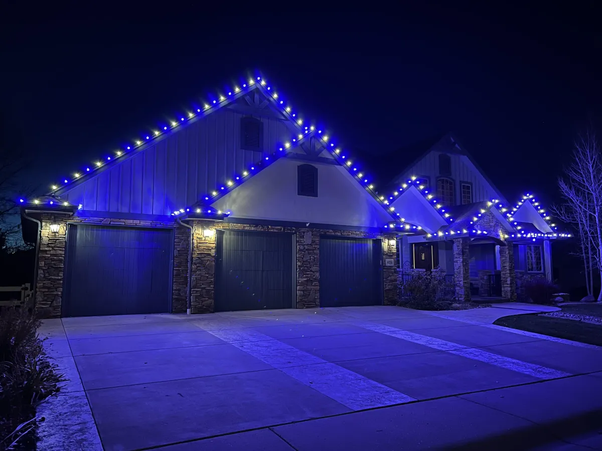 Windsor home with professionally installed LED roofline Christmas lights warm white and blue