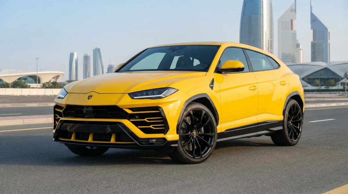 Yellow Lamborghini Urus parked in Dubai with modern skyline in the background