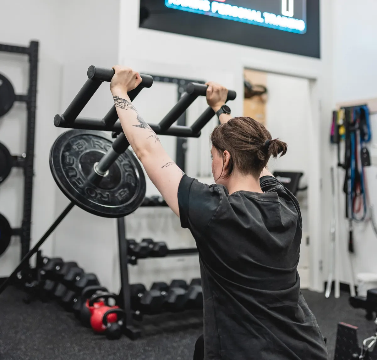 woman in black tank top and black shorts standing