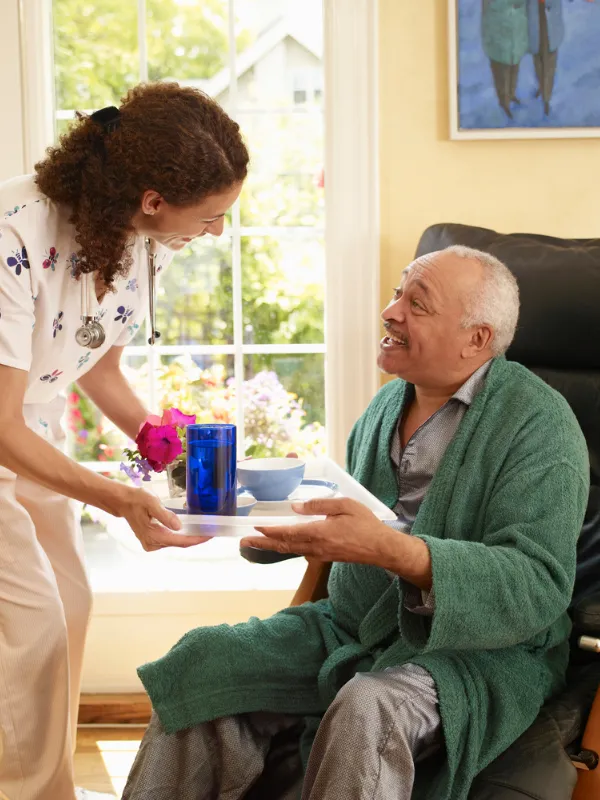 Evercare at Home caregiver with patient