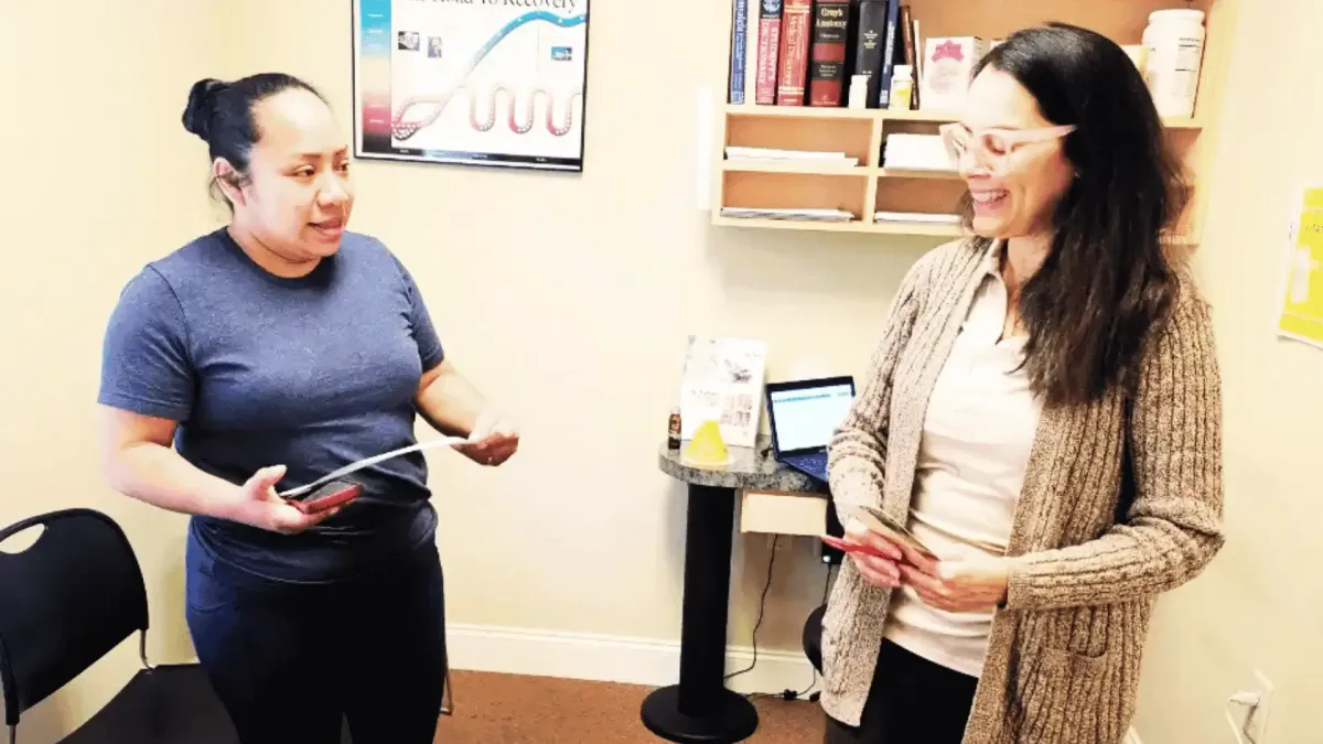 Dr. Patricia Peña discussing metabolic health with a patient in Gainesville, GA